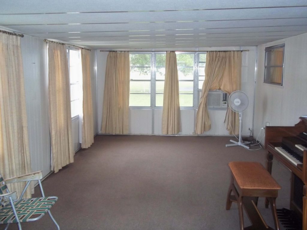 Large Florida Room just after entering the home. Air Conditioned